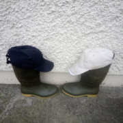 Wellington boots with baseball caps on them