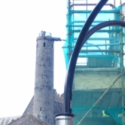 Tall round tower next to scaffolding